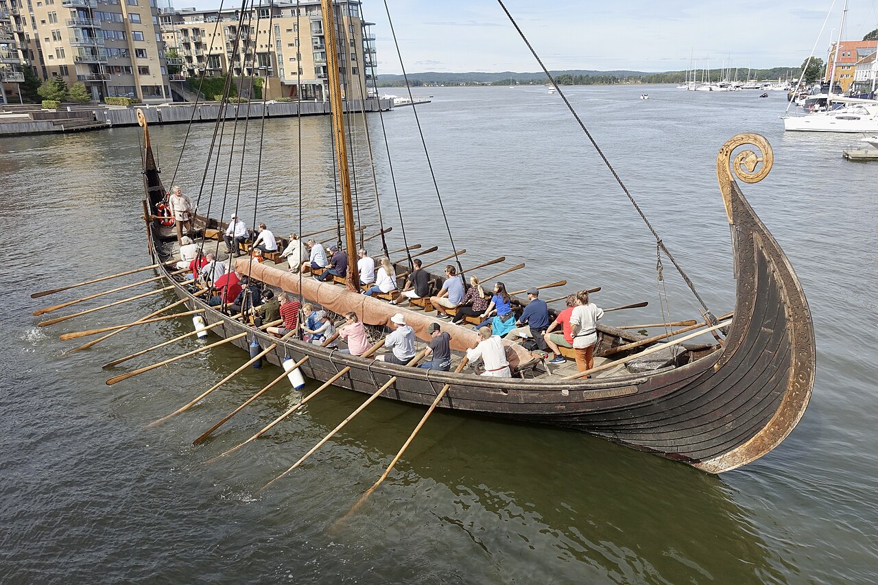 Crew rowing the Saga Oseberg Viking longship replica in Tonsberg, Norway