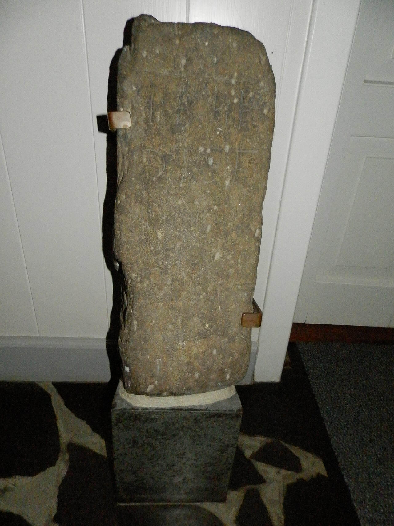 The Fámjin Stone, a Faroese runestone carved with runic and Latin letters, inside a Faroe Islands church