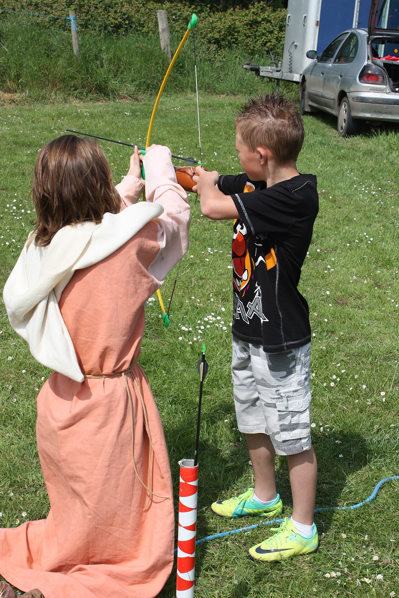 Costumed Viking reenactors gathered at an outdoor living-history festival